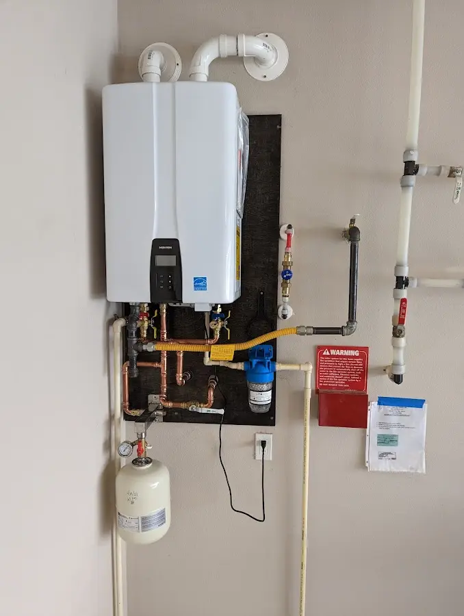 Professional plumber installing copper piping in a Eagle Lake home